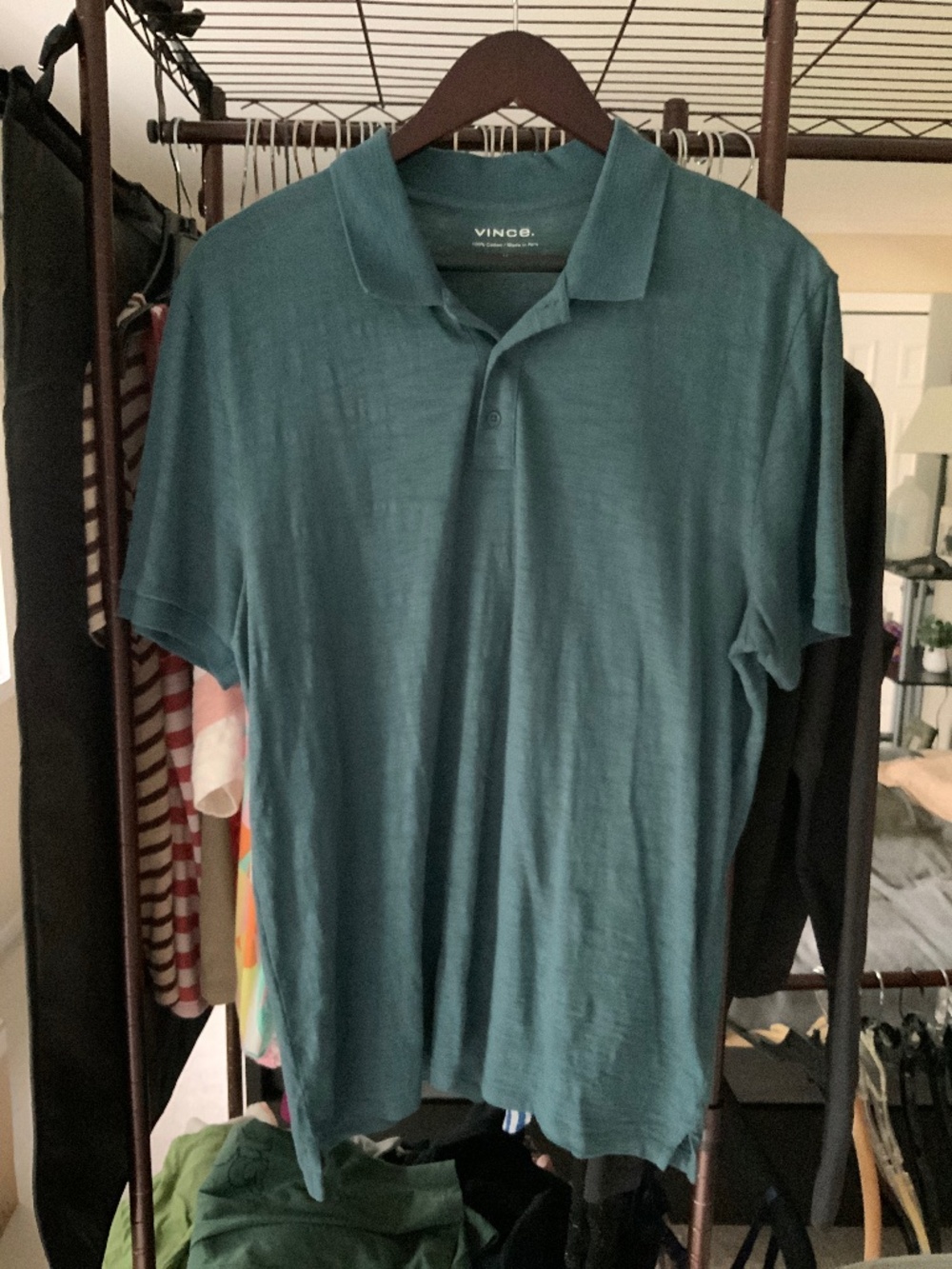 Mens medium steel grey polo with button placket. Never worn no tags